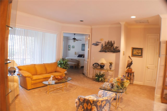 living room featuring ceiling fan, light carpet, and ornamental molding