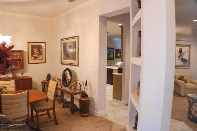 dining space featuring light colored carpet and crown molding