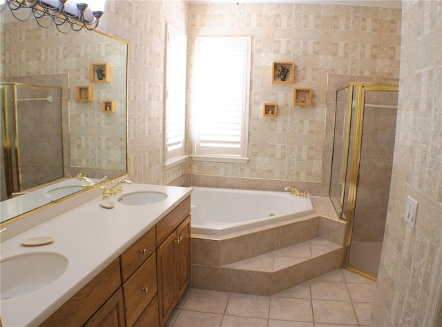 bathroom with tile walls, shower with separate bathtub, tile patterned floors, and vanity