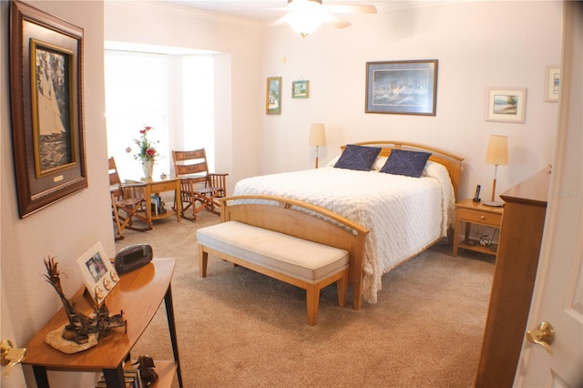 bedroom featuring light carpet, ceiling fan, and crown molding