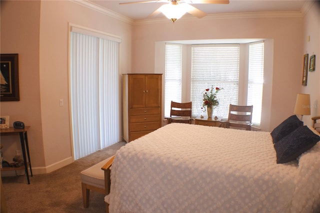 carpeted bedroom featuring ceiling fan and crown molding