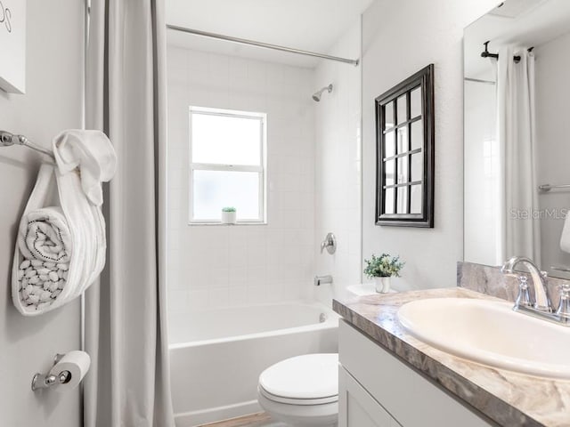 full bathroom featuring toilet, shower / bath combo, vanity, and hardwood / wood-style floors