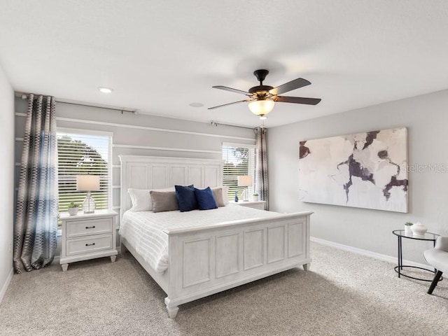 carpeted bedroom with ceiling fan