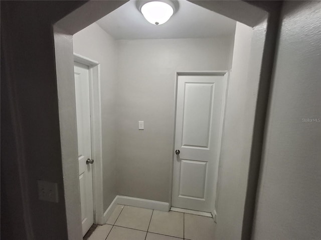 hallway featuring light tile patterned floors