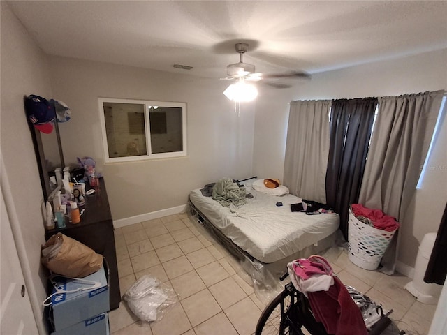 bedroom featuring ceiling fan and light tile patterned flooring