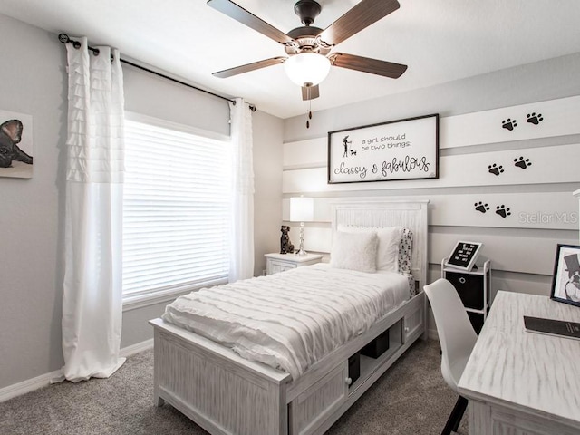 carpeted bedroom with multiple windows and ceiling fan