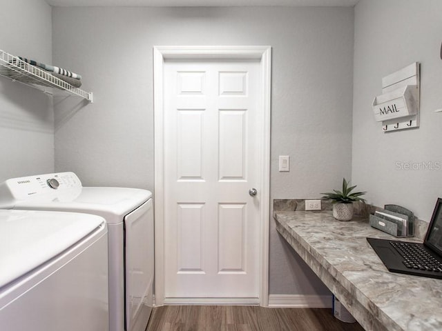 clothes washing area with dark hardwood / wood-style flooring and washing machine and clothes dryer