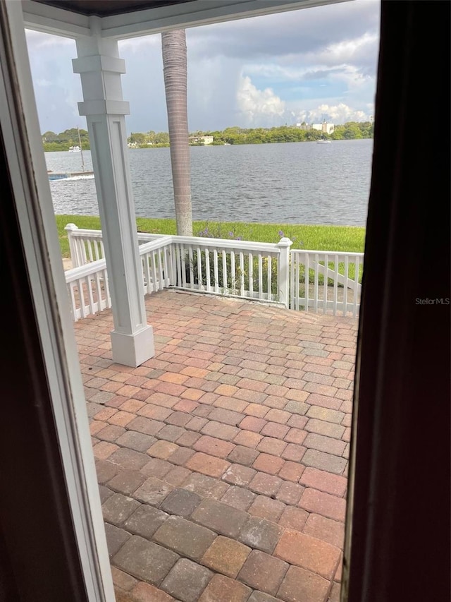 view of patio with a water view