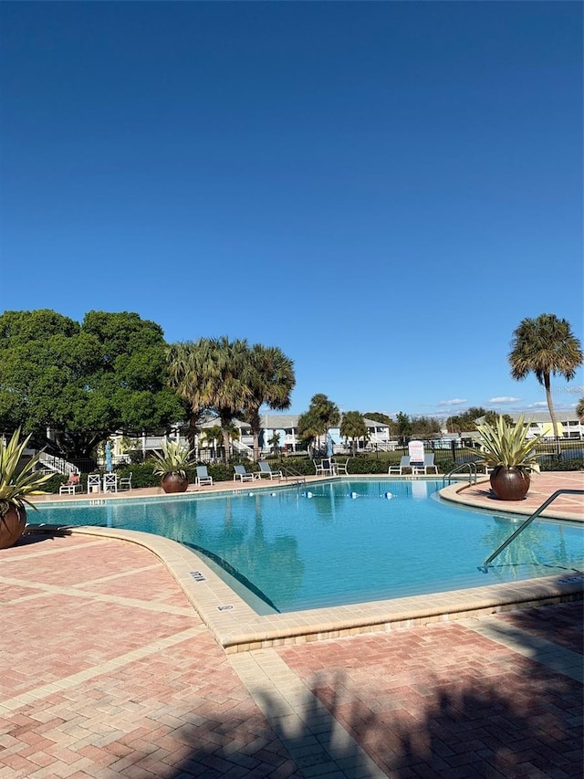 view of swimming pool with a patio