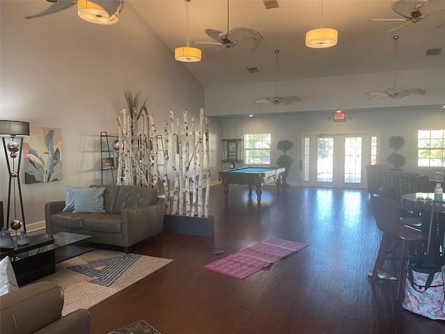 living room with high vaulted ceiling, dark wood-type flooring, and pool table