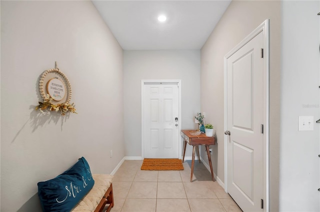 doorway featuring light tile patterned floors