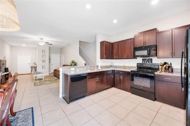 kitchen with black appliances, light tile patterned floors, sink, kitchen peninsula, and ceiling fan