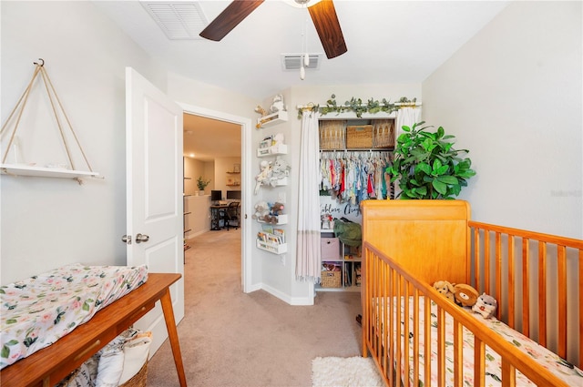 carpeted bedroom with ceiling fan