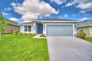 ranch-style home featuring a garage and a front yard