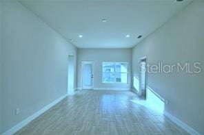 empty room featuring hardwood / wood-style floors