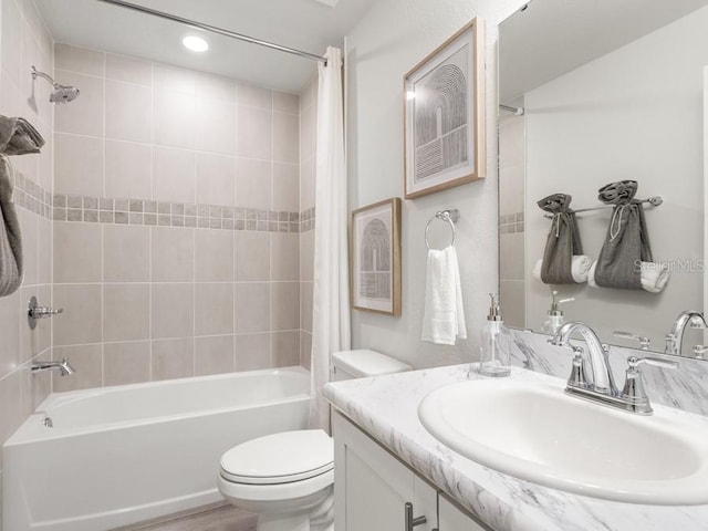 full bathroom featuring toilet, vanity, and shower / bath combo with shower curtain