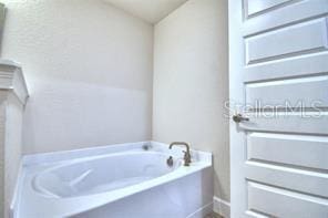 bathroom with a bathing tub