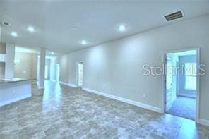 1580 Leamington Ln, Winter Haven, FL 33884 - unfurnished living room with recessed lighting and baseboards