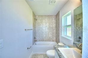 1580 Leamington Ln, Winter Haven, FL 33884 - bathroom with vanity and bathing tub / shower combination