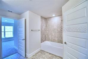1580 Leamington Ln, Winter Haven, FL 33884 - full bath featuring bathing tub / shower combination and tile patterned flooring