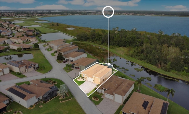 birds eye view of property featuring a water view