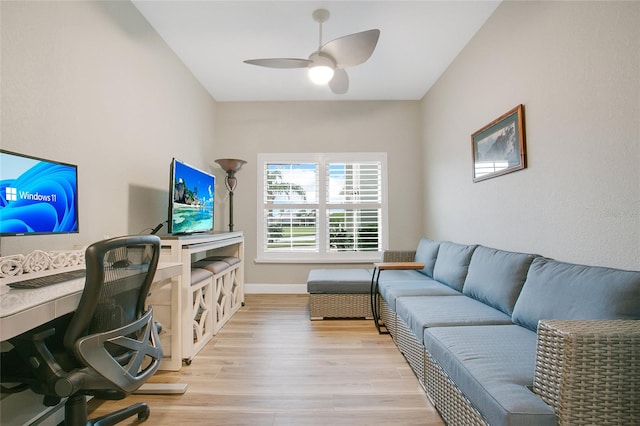 office space featuring ceiling fan and light hardwood / wood-style flooring