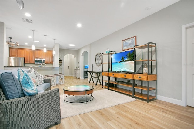 living room with light hardwood / wood-style flooring