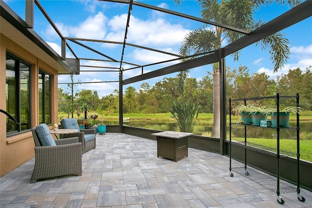 unfurnished sunroom featuring a water view