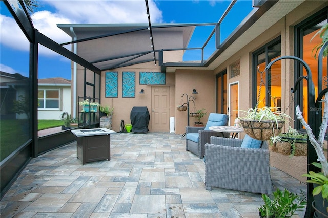 view of patio / terrace with glass enclosure