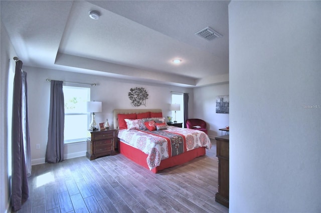 bedroom with hardwood / wood-style flooring