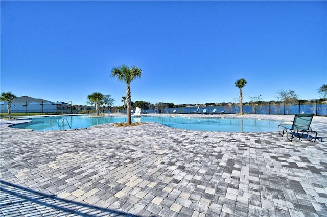 view of swimming pool with a patio area