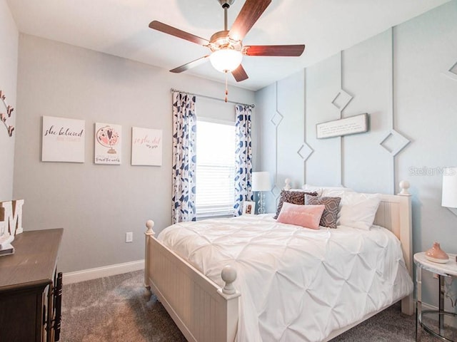 bedroom with ceiling fan and dark carpet