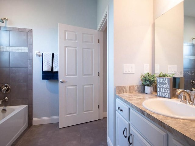 bathroom with vanity, tile patterned floors, and tiled shower / bath combo