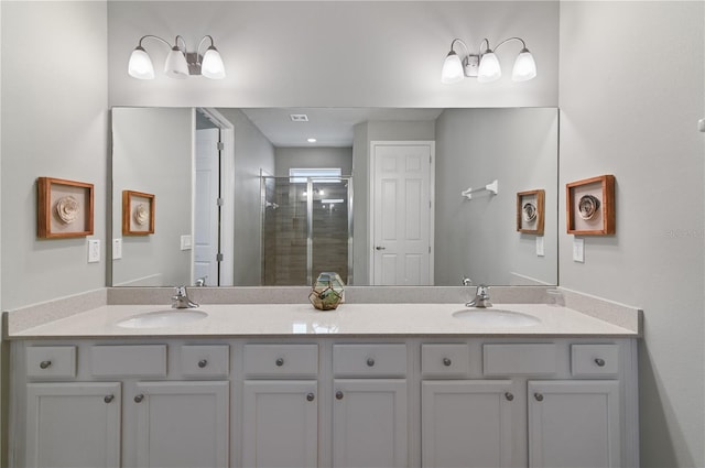 bathroom featuring walk in shower and vanity