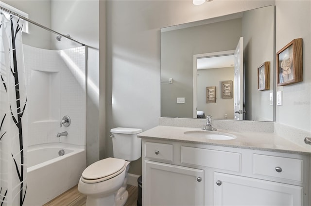 full bathroom with shower / tub combo with curtain, vanity, hardwood / wood-style floors, and toilet