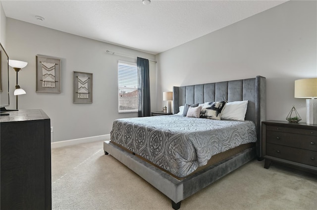 carpeted bedroom with a textured ceiling