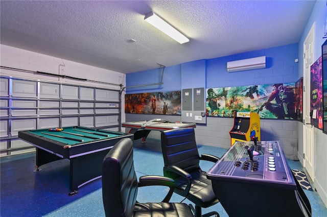 playroom featuring a wall mounted AC, a textured ceiling, and pool table