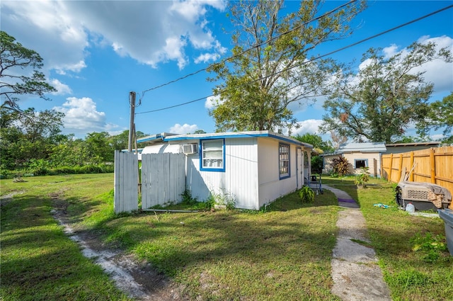 view of side of property featuring a yard