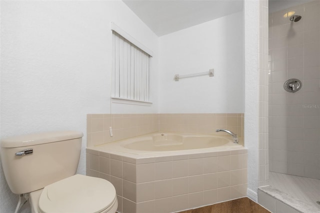 bathroom with hardwood / wood-style floors, toilet, and separate shower and tub