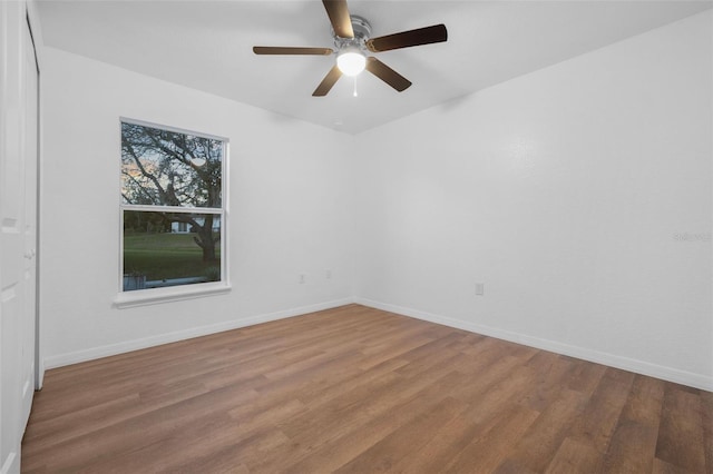 unfurnished room featuring wood-type flooring and ceiling fan