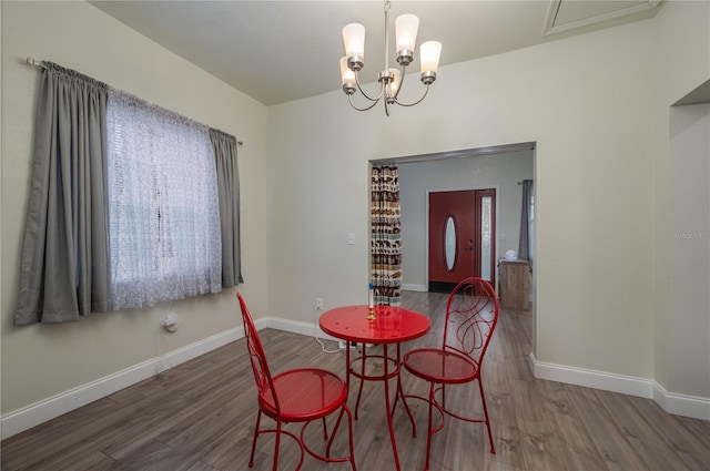 dining room with an inviting chandelier and hardwood / wood-style floors