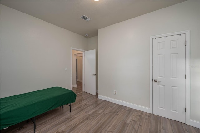 bedroom featuring light hardwood / wood-style floors