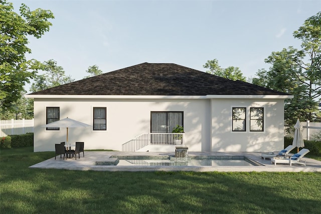 rear view of house featuring a yard and a patio