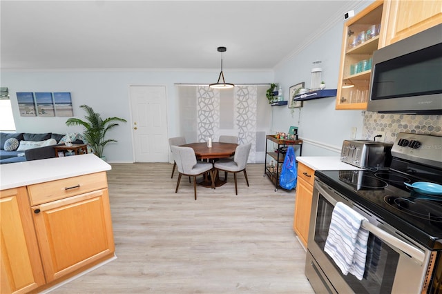 kitchen with appliances with stainless steel finishes, hanging light fixtures, ornamental molding, decorative backsplash, and light wood-type flooring