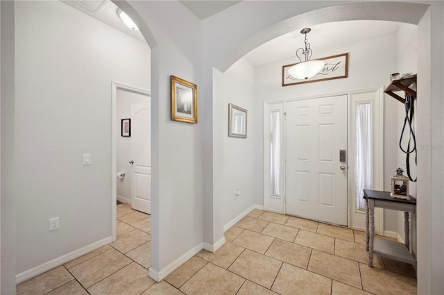 entryway with light tile patterned flooring