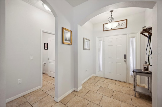 1849 Charleston Ln, Bartow, FL 33830 - foyer with light tile patterned flooring, arched walkways, and baseboards