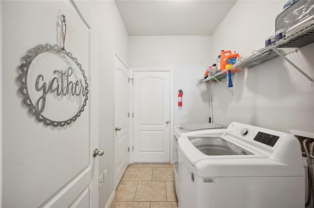 1849 Charleston Ln, Bartow, FL 33830 - laundry area featuring washer and dryer and a textured ceiling