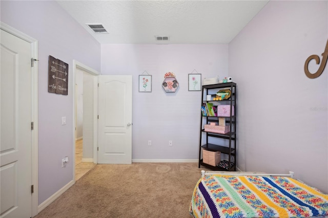 1849 Charleston Ln, Bartow, FL 33830 - carpeted bedroom with baseboards and a textured ceiling