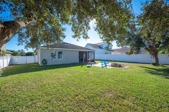 1849 Charleston Ln, Bartow, FL 33830 - back of house featuring stucco siding, a patio area, and a gate