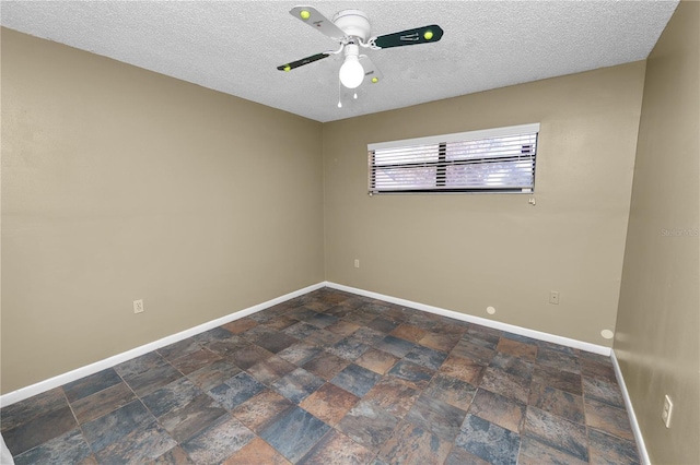 unfurnished room featuring a textured ceiling and ceiling fan